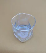 لیوان شیشه ای دفرمه طرح هفت رنگ - فراکالا - Deformed glass mug with seven-color design